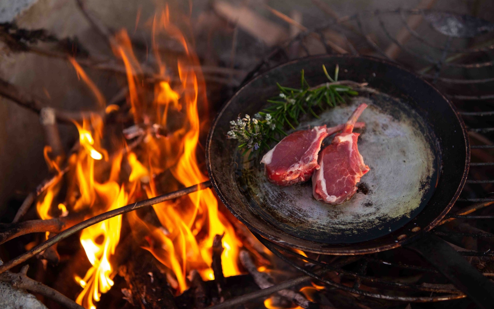 Iona-cooking-over-fire
